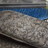Look at the detail on this silver eyeglass case!